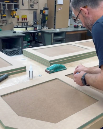 Image of man working on Shaker doors